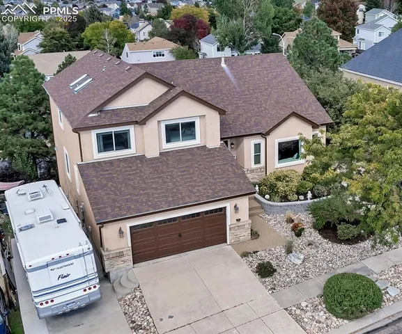 a aerial view of a house with a yard