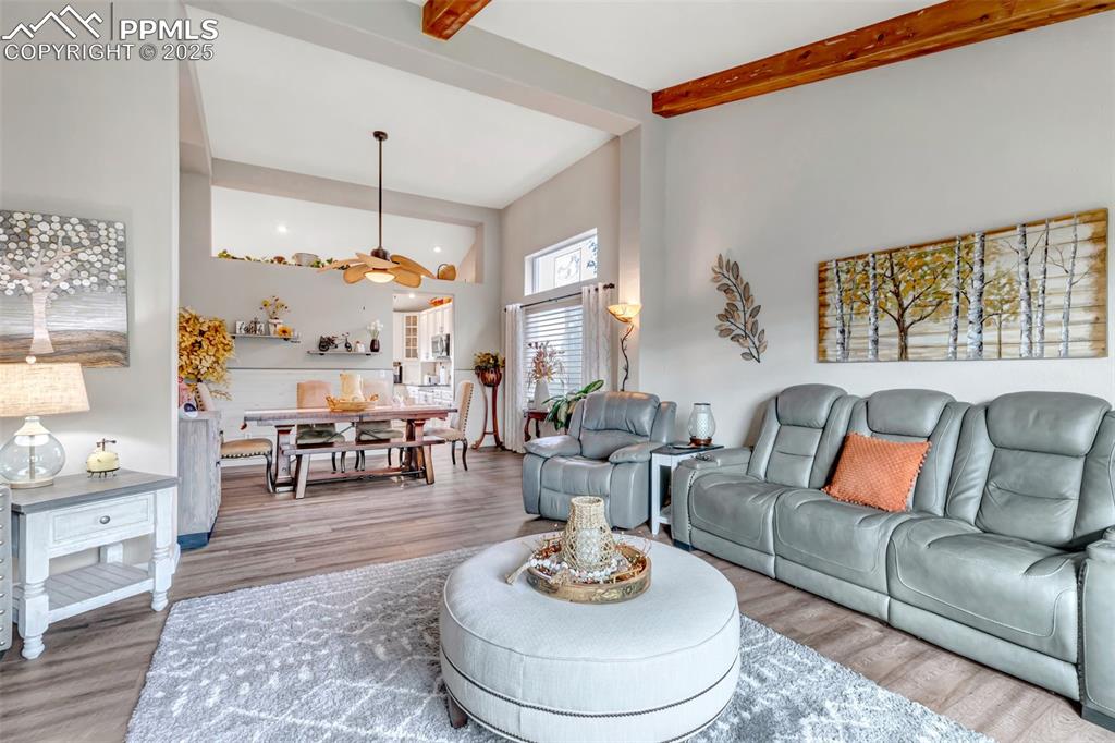 7120 Highcroft Drive Colorado Springs, CO 80922 - Photo 7 of 50 a living room with furniture kitchen view and a large window
