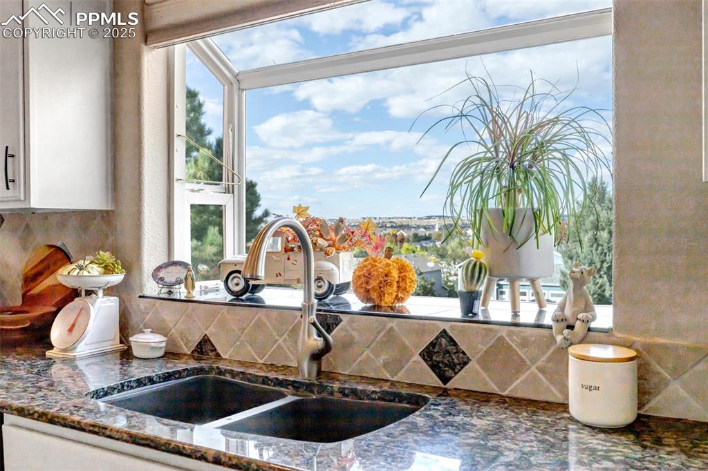 7120 Highcroft Drive Colorado Springs, CO 80922 - Photo 10 of 50 a kitchen with a sink and a large window