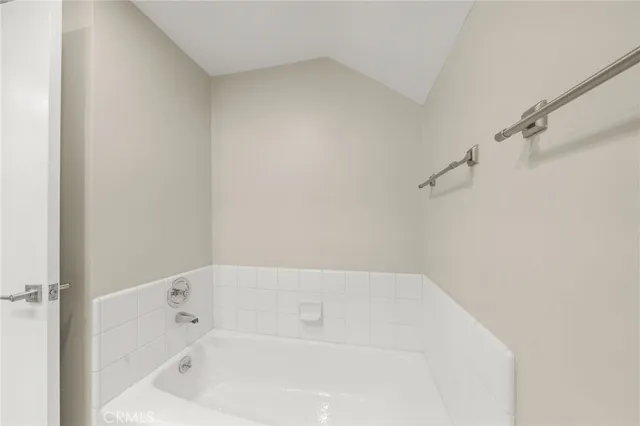 a white bath tub sitting in a bathroom