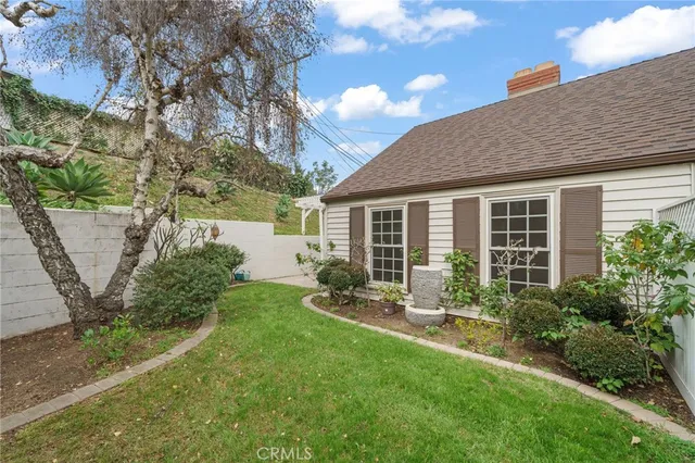 a view of a patio with table and chairs with wooden floor and fence