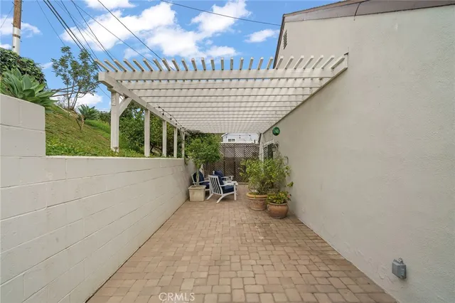 a view of an chairs and table in the patio