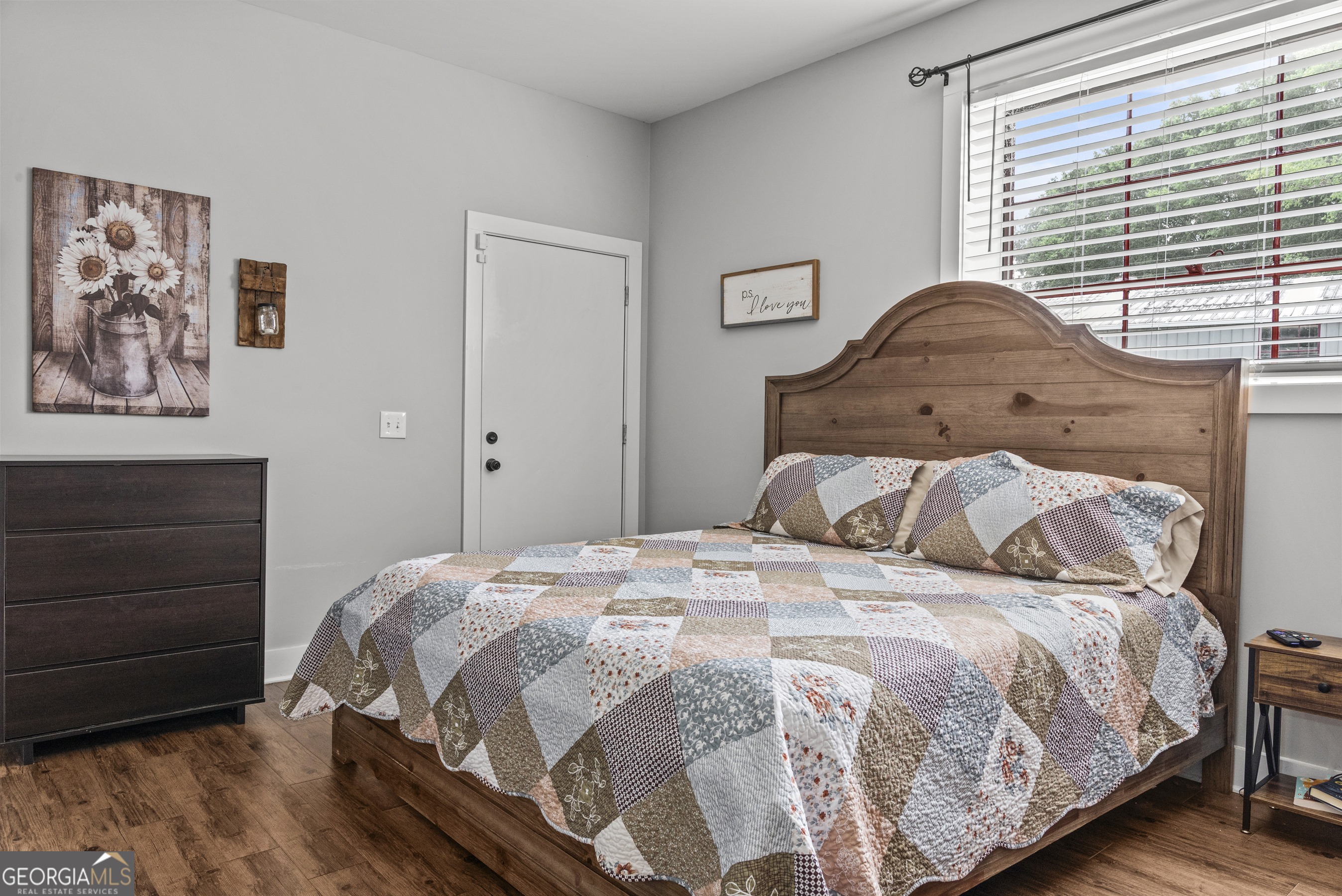 370 Park Street, Unit 8 Madison, GA 30650 - Photo 11 of 22 a large bed sitting in a bedroom next to a window