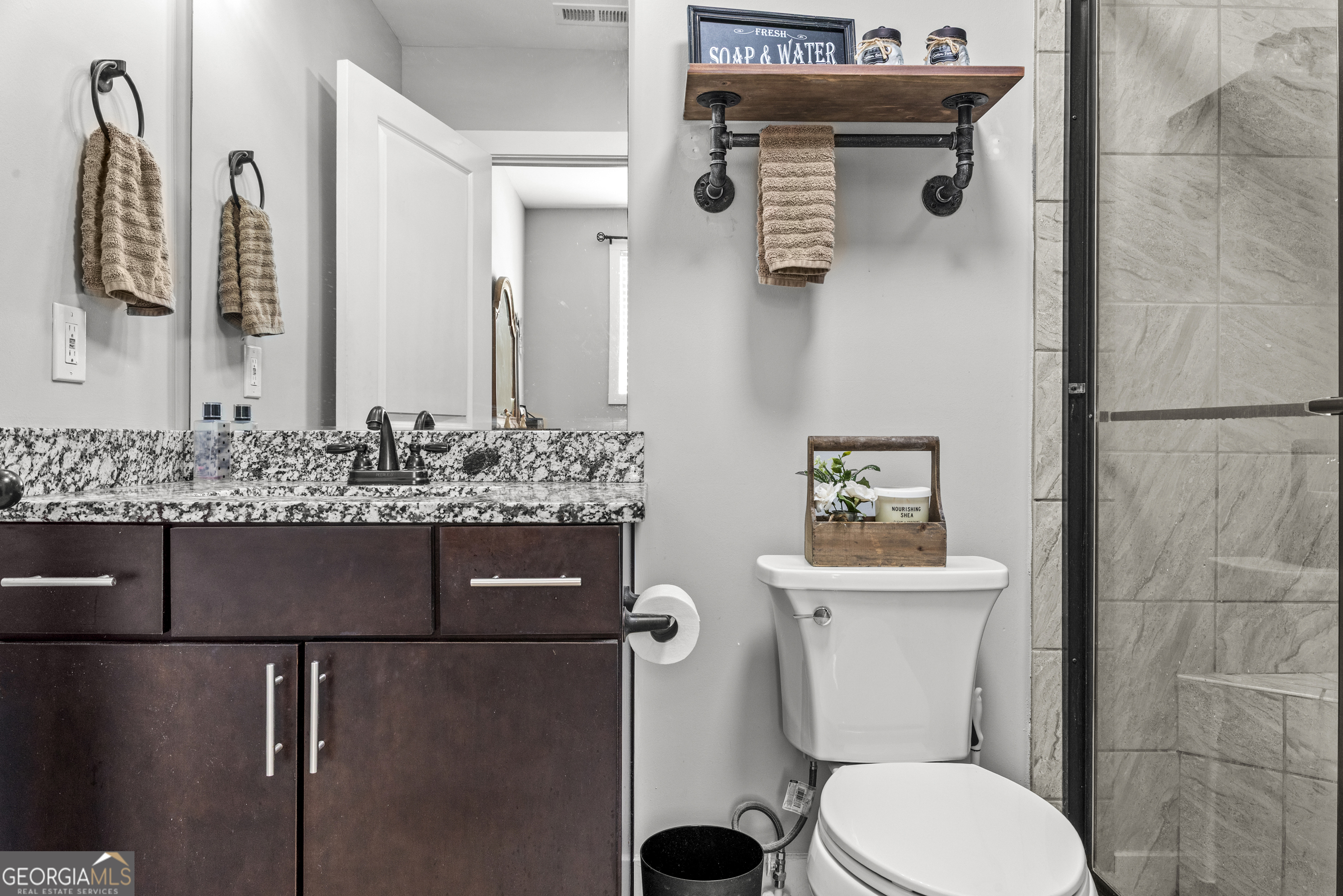 370 Park Street, Unit 8 Madison, GA 30650 - Photo 12 of 22 a bathroom with a sink and a toilet