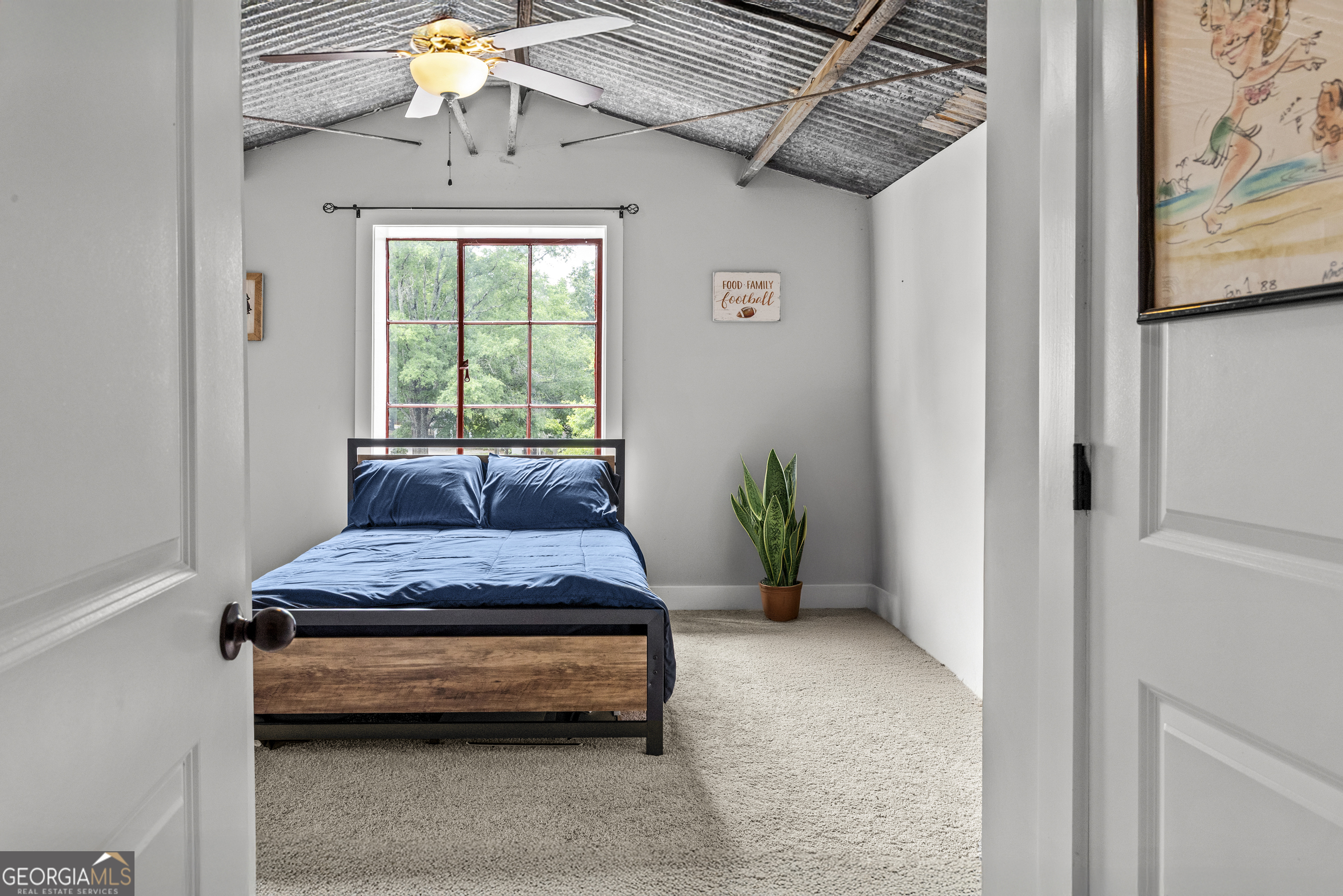 370 Park Street, Unit 8 Madison, GA 30650 - Photo 13 of 22 a bedroom with a bed and a chandelier