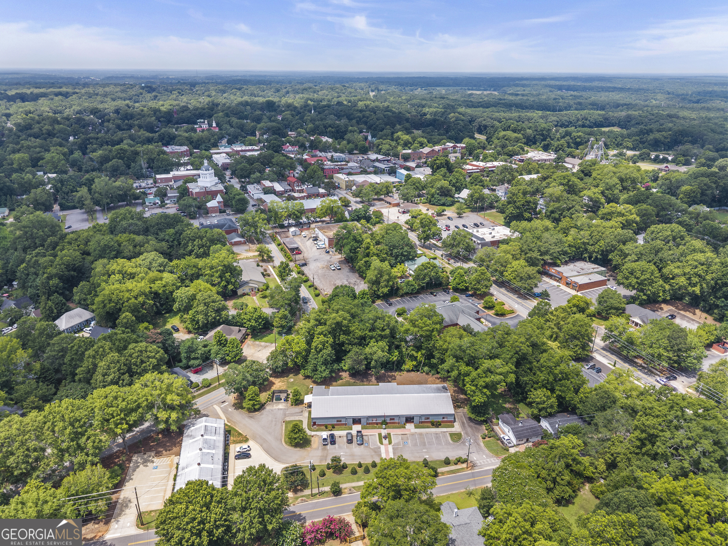 370 Park Street, Unit 8 Madison, GA 30650 - Photo 16 of 22 an aerial view of a city with lots of residential buildings