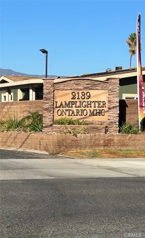 a front view of a building with a road