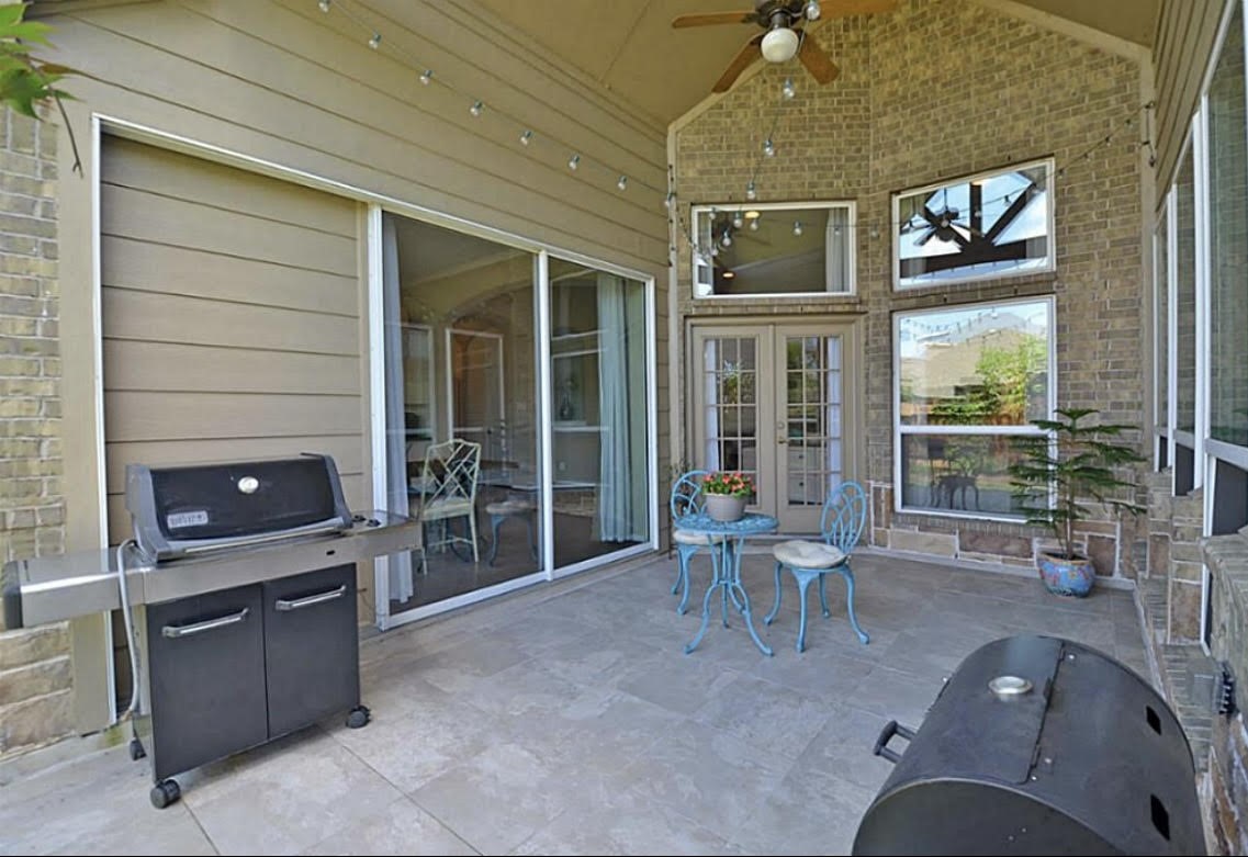 1447 Ralston Branch Way Sugar Land, TX 77479 - Photo 15 of 21 Out back, the covered patio extends the living space effortlessly. With high ceilings and easy indoor/outdoor flow, it’s the perfect spot for al fresco dining, evening gatherings, or weekend barbecue.