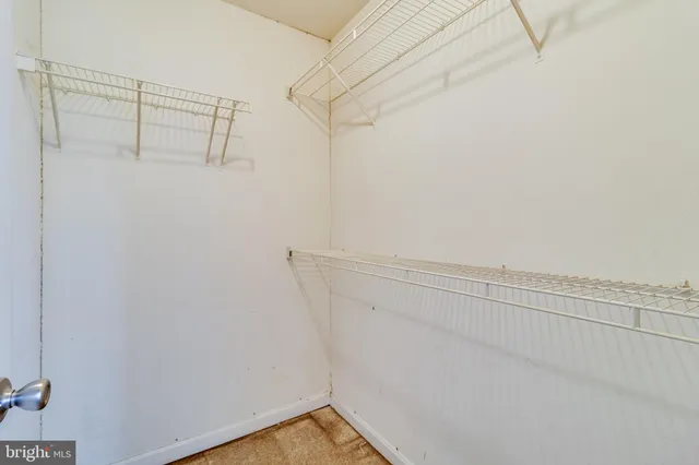 a view of a room with racks on the wall