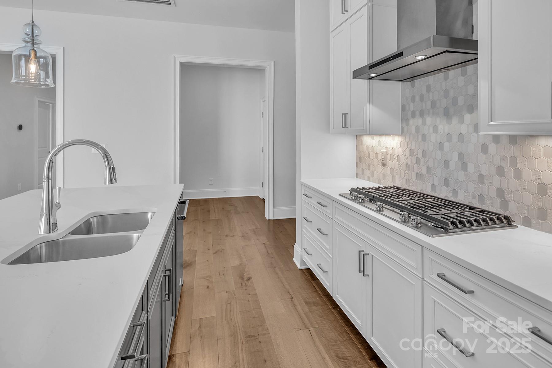 14008 Little Spring Court Charlotte, NC 28278 - Photo 14 of 44 a kitchen with sink a stove and refrigerator