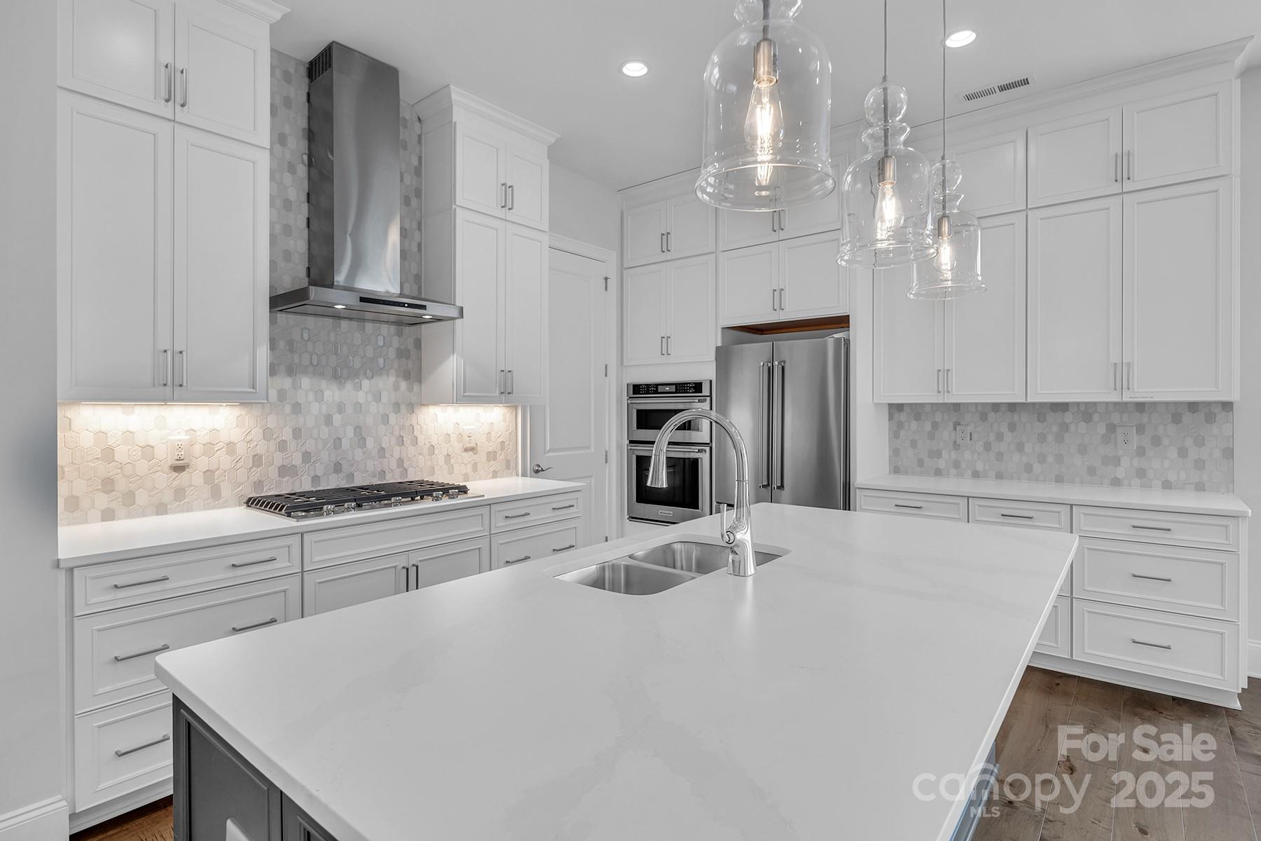 14008 Little Spring Court Charlotte, NC 28278 - Photo 18 of 44 a kitchen with stainless steel appliances granite countertop a sink a stove a refrigerator and cabinets