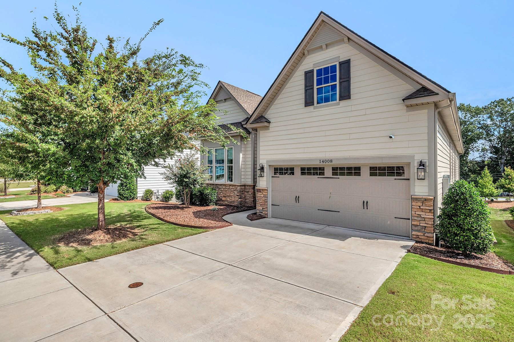 14008 Little Spring Court Charlotte, NC 28278 - Photo 2 of 44 a view of a house with a yard and potted plants