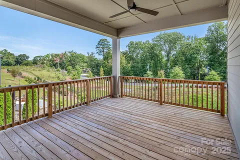 a view of a balcony with wooden floor