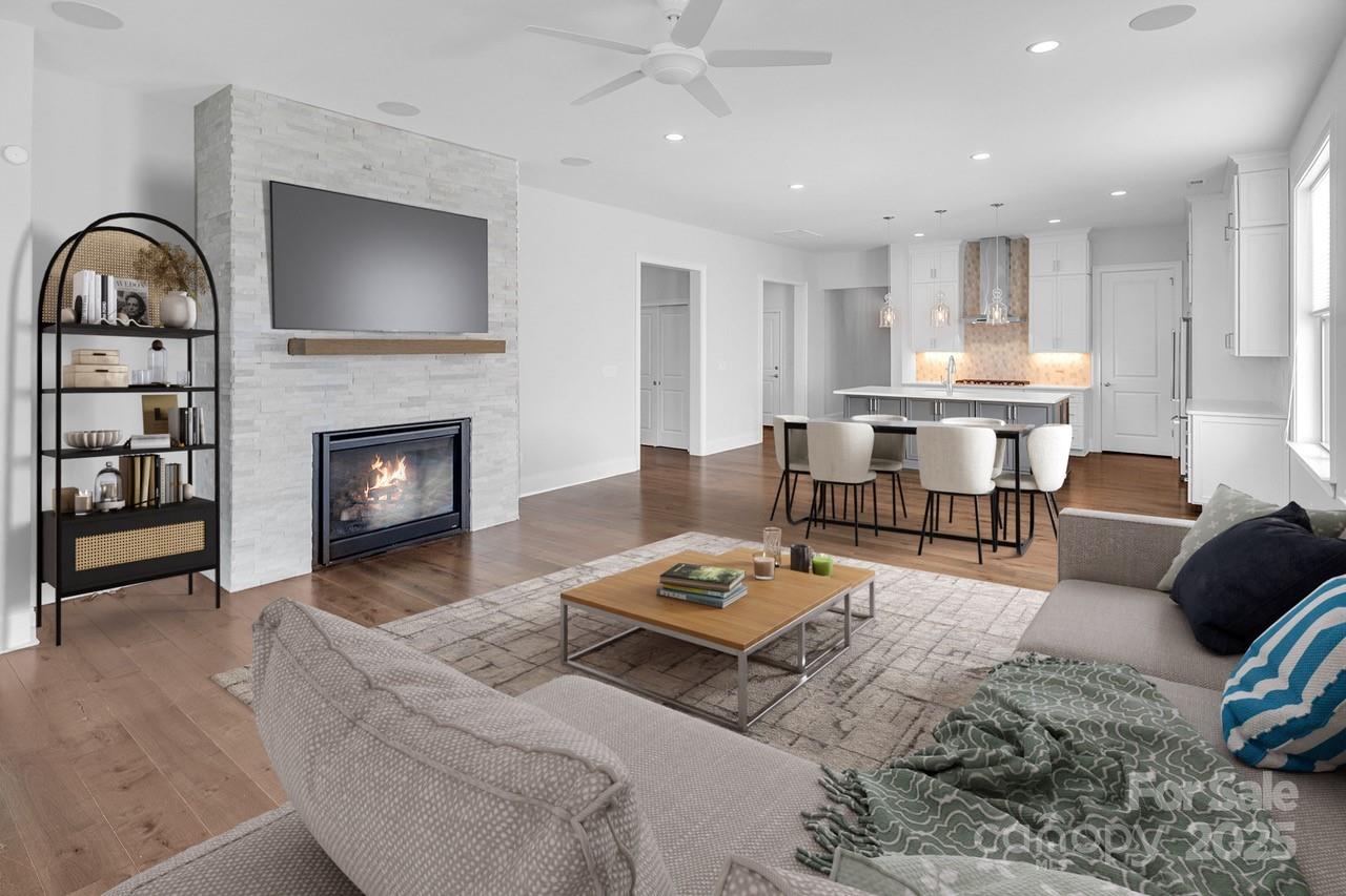14008 Little Spring Court Charlotte, NC 28278 - Photo 5 of 44 a living room with furniture and a fireplace