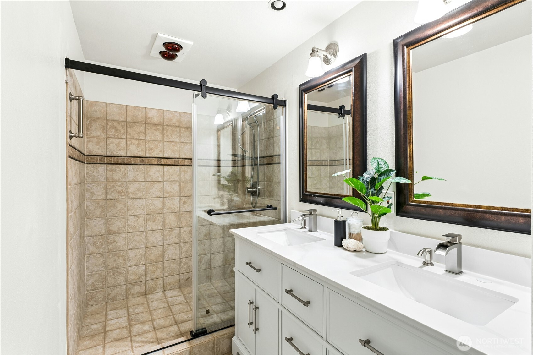 18152 145th Avenue Southeast Renton, WA 98058 - Photo 26 of 40 a bathroom with a granite countertop sink a mirror and shower