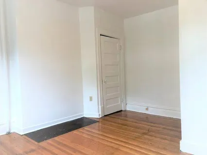 a picture of a wall with a white fence