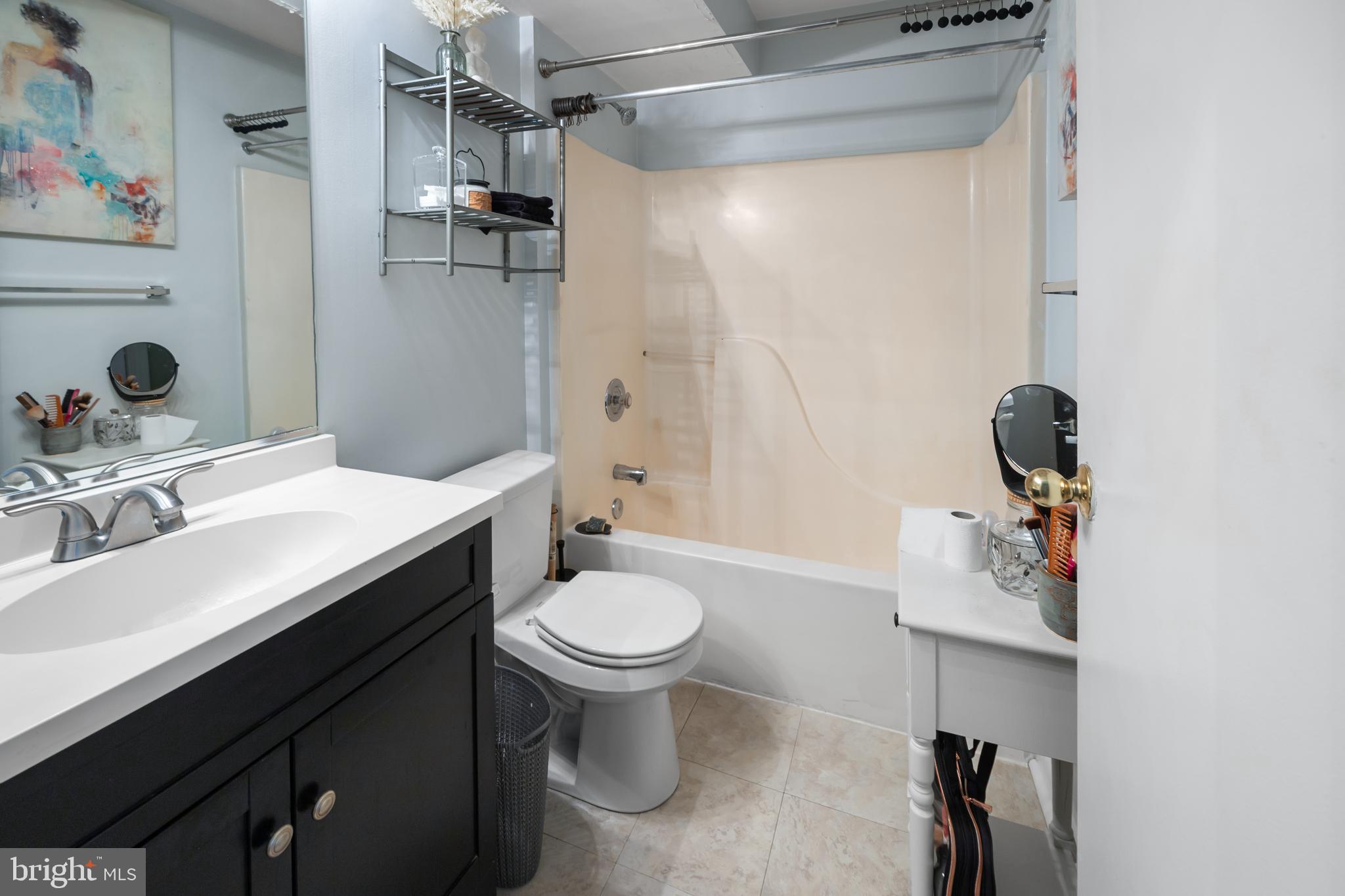 10 Sandstone Court Annapolis, MD 21403 - Photo 12 of 17 a bathroom with a sink toilet a mirror and shower