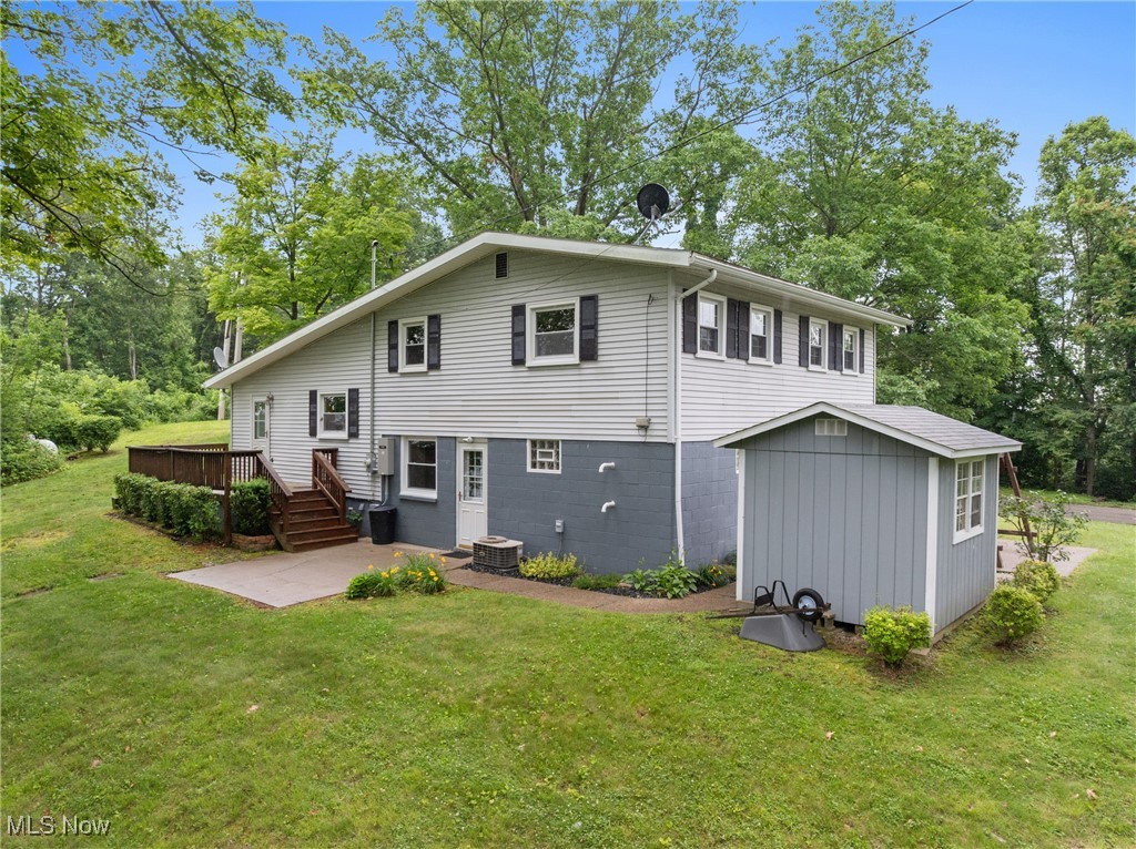 59937 Broadview Road Shadyside, OH 43947 - Photo 28 of 36 Back of property with a yard, a patio area, a deck, and view of wooded area