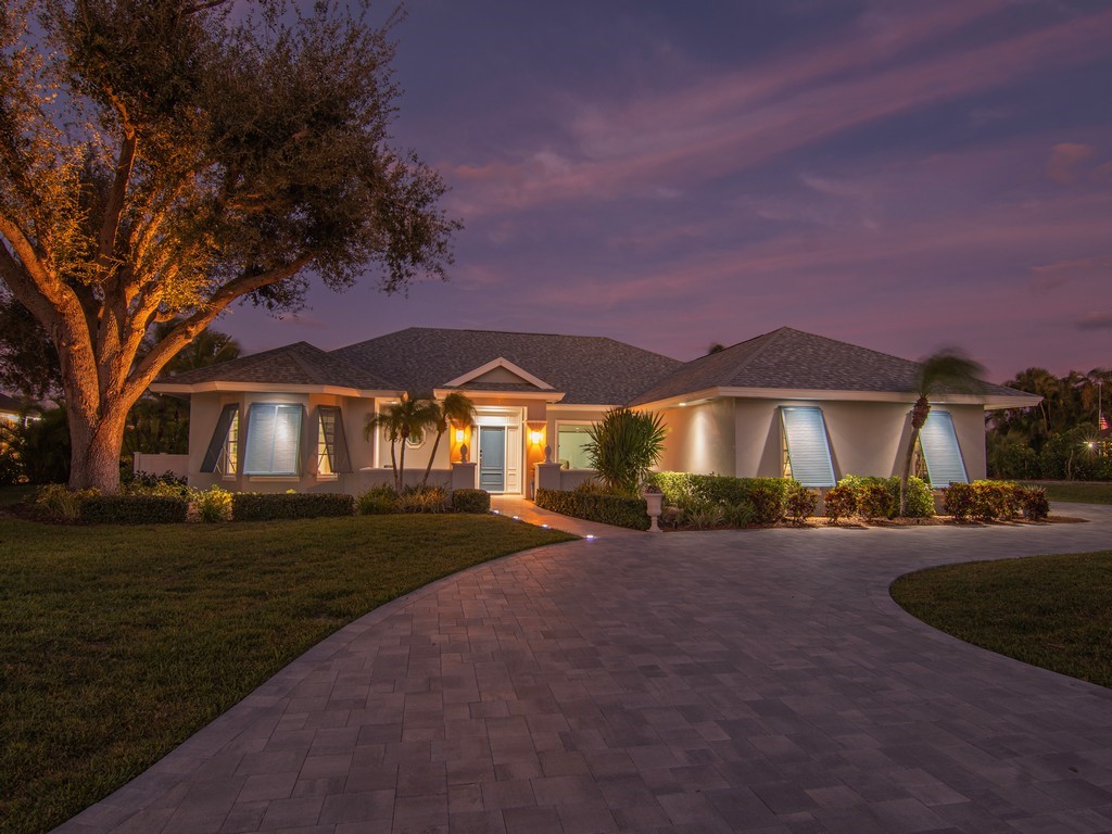1 Cache Cay Drive Vero Beach, FL 32963 - Photo 2 of 36 a front view of a house with yard and green space