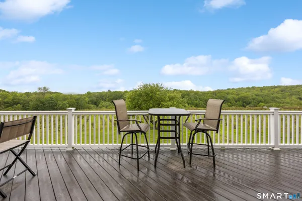 a view of a chairs on wooden deck