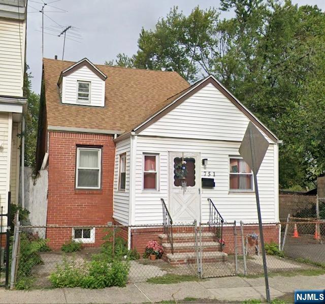 a front view of a house with garage