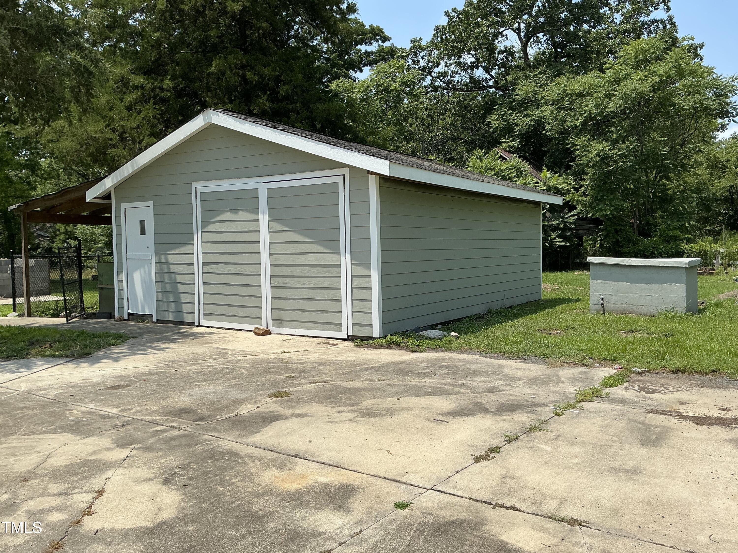 3417 Glenn Road Durham, NC 27704 - Photo 15 of 80 a front view of a house with a garage