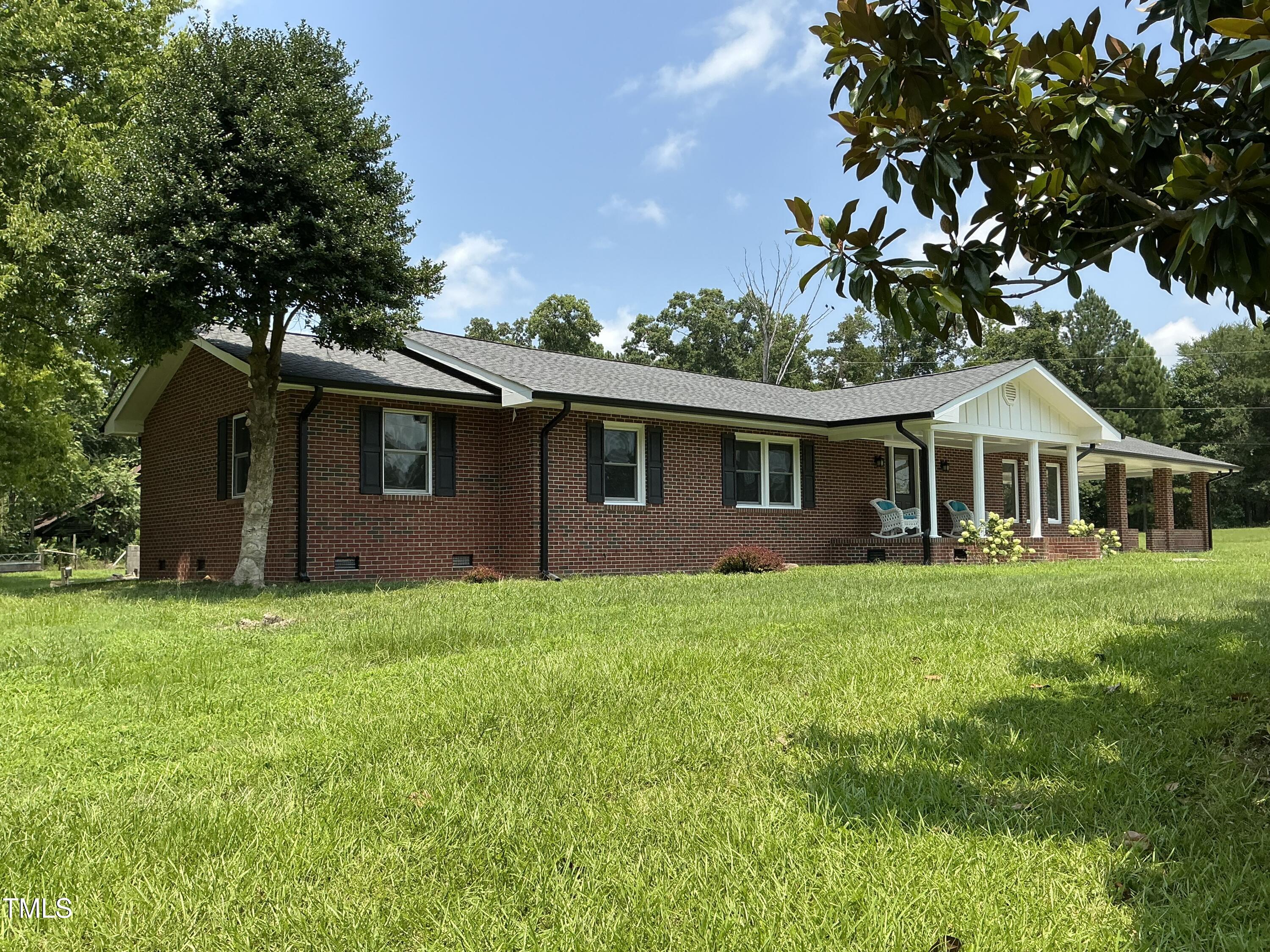 3417 Glenn Road Durham, NC 27704 - Photo 16 of 80 a front view of a house with a garden