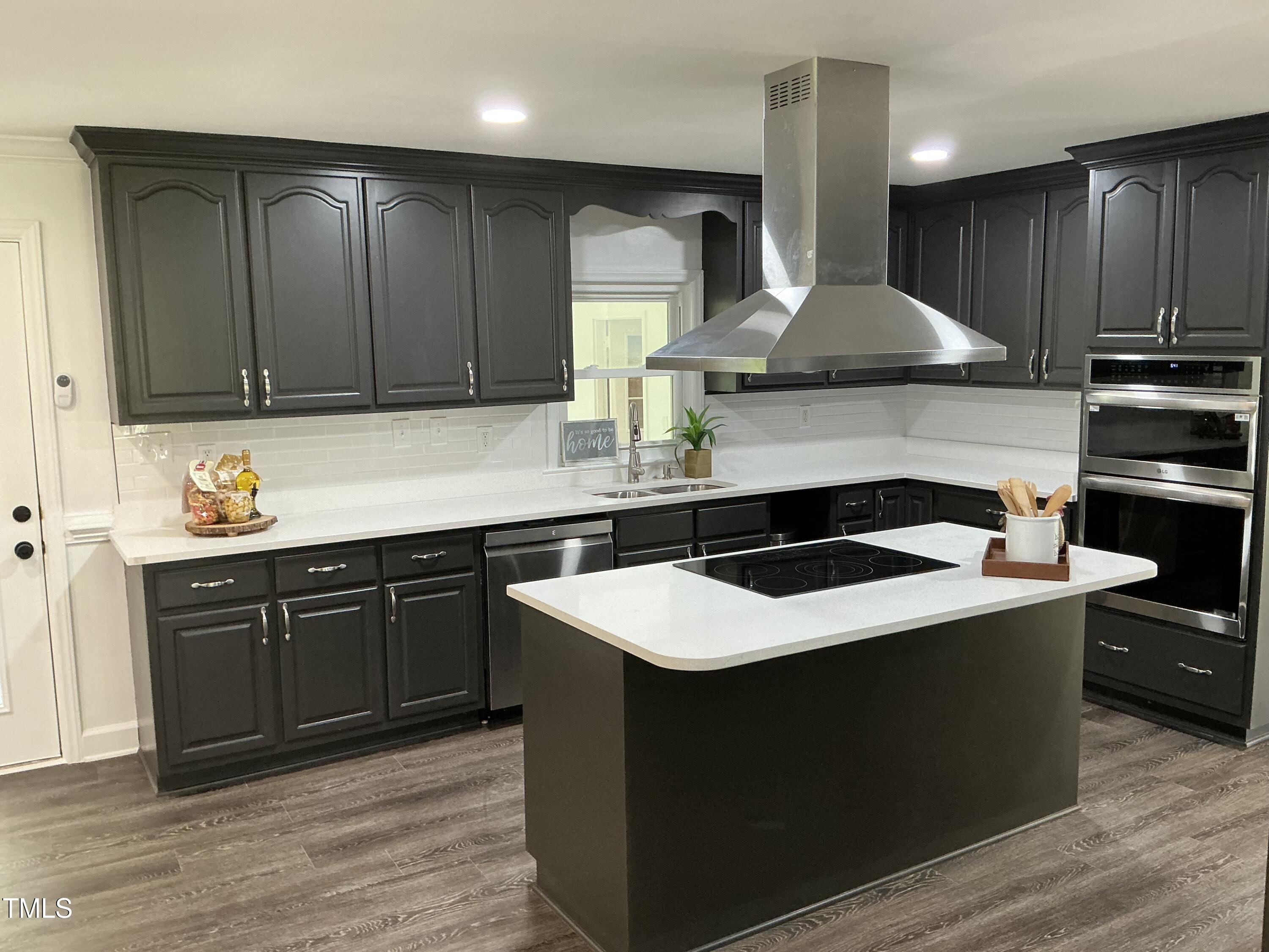 3417 Glenn Road Durham, NC 27704 - Photo 48 of 80 a kitchen with stainless steel appliances granite countertop a sink stove and refrigerator