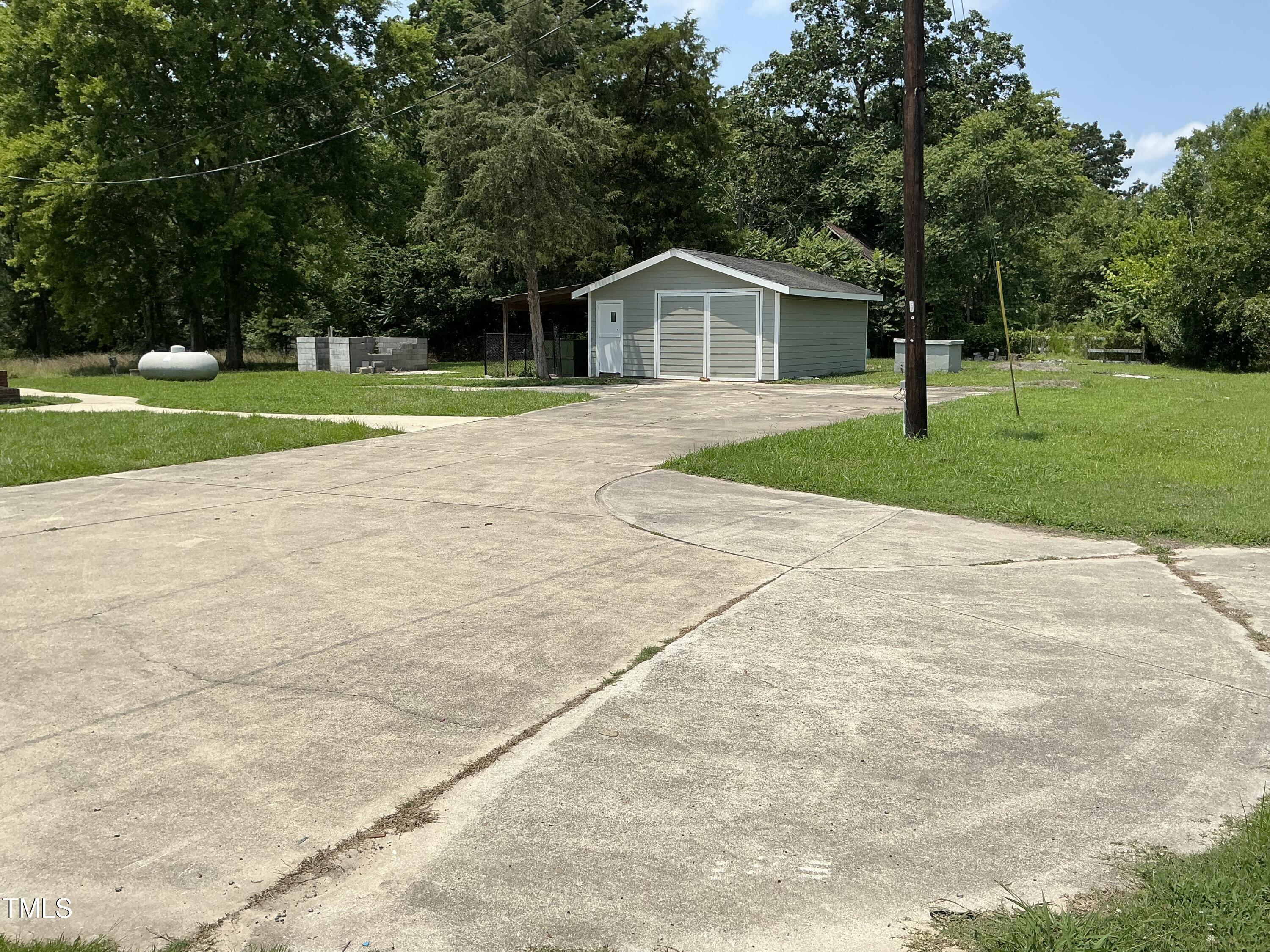3417 Glenn Road Durham, NC 27704 - Photo 9 of 80 a front view of a house with a yard
