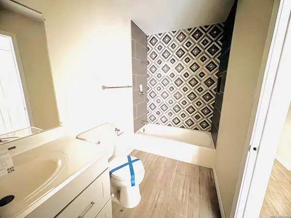 a bathroom with a bathtub and a sink