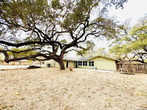 a house with trees in front of it