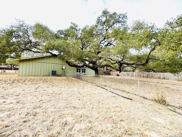 a view of a backyard of the house