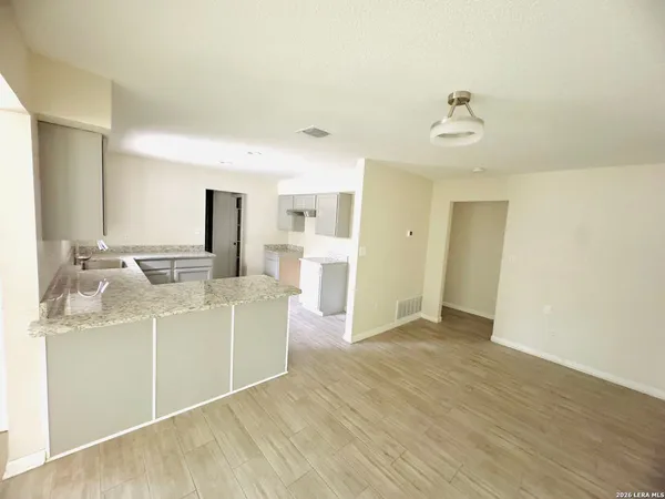 a view of a kitchen with a sink