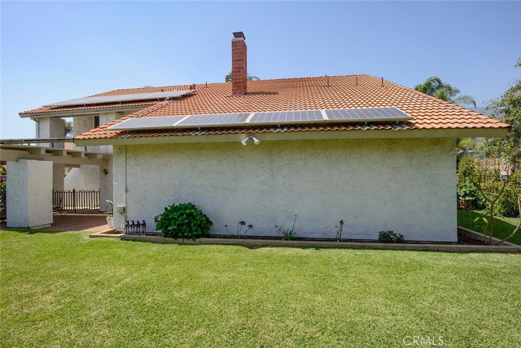 10424 Cartilla Court Rancho Cucamonga, CA 91737 - Photo 26 of 36 a front view of a house with a garden