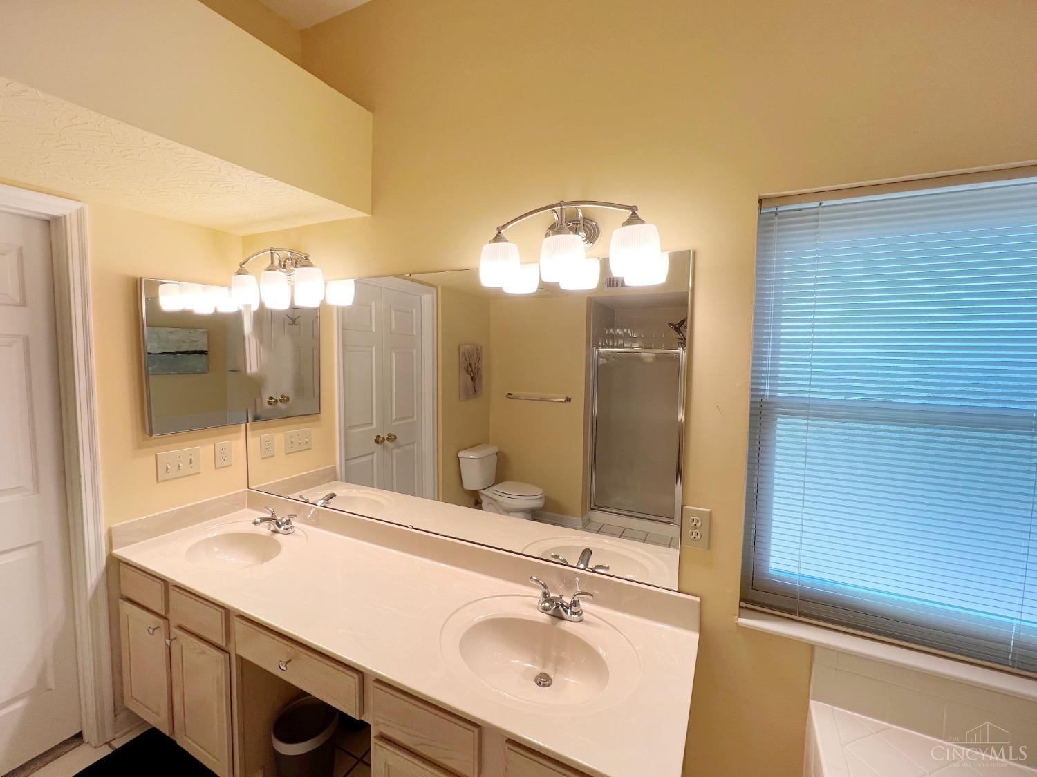 8408 Ridge Pointe Court, Unit 13 Reading, OH 45237 - Photo 15 of 39 Here's the view of the double vanity in the primary bathroom.