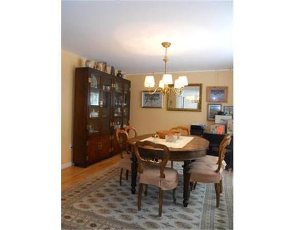62 Claybrook Road Sunderland, MA 01375 - Photo 2 of 15 a view of a dining room with furniture and chandelier