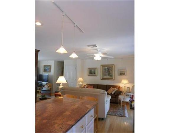 62 Claybrook Road Sunderland, MA 01375 - Photo 4 of 15 a bedroom with a bed and a chandelier