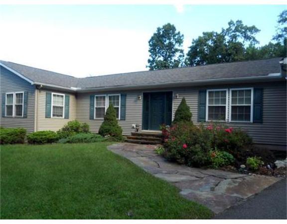 62 Claybrook Road Sunderland, MA 01375 - Photo 9 of 15 a view of a house with a yard and plants