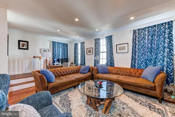a living room with furniture and a couch