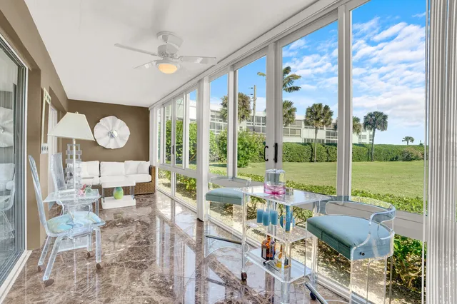 a living room with large windows