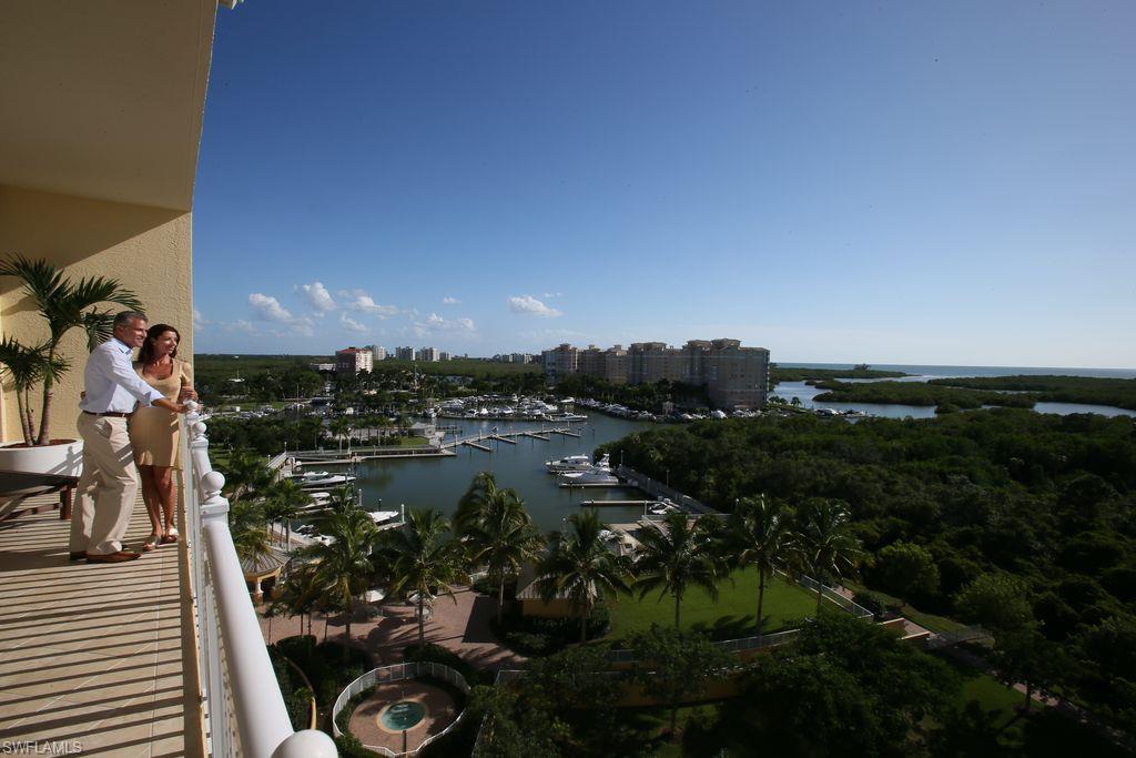 13665 Vanderbilt Drive, Unit 701 Naples, FL 34110 - Photo 17 of 22 a view of a lake