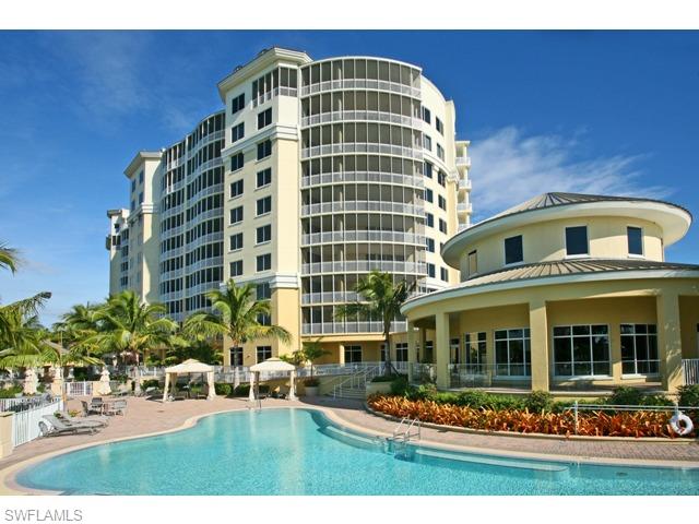 13665 Vanderbilt Drive, Unit 701 Naples, FL 34110 - Photo 18 of 22 a front view of a building