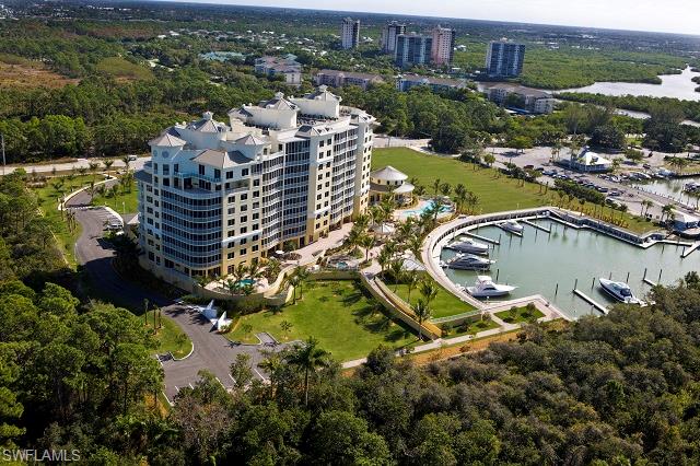 13665 Vanderbilt Drive, Unit 701 Naples, FL 34110 - Photo 5 of 22 an aerial view of residential houses with outdoor space and river
