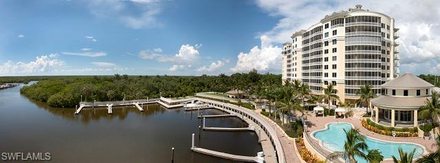 13665 Vanderbilt Drive, Unit 701 Naples, FL 34110 - Photo 7 of 22 a view of a balcony with chairs