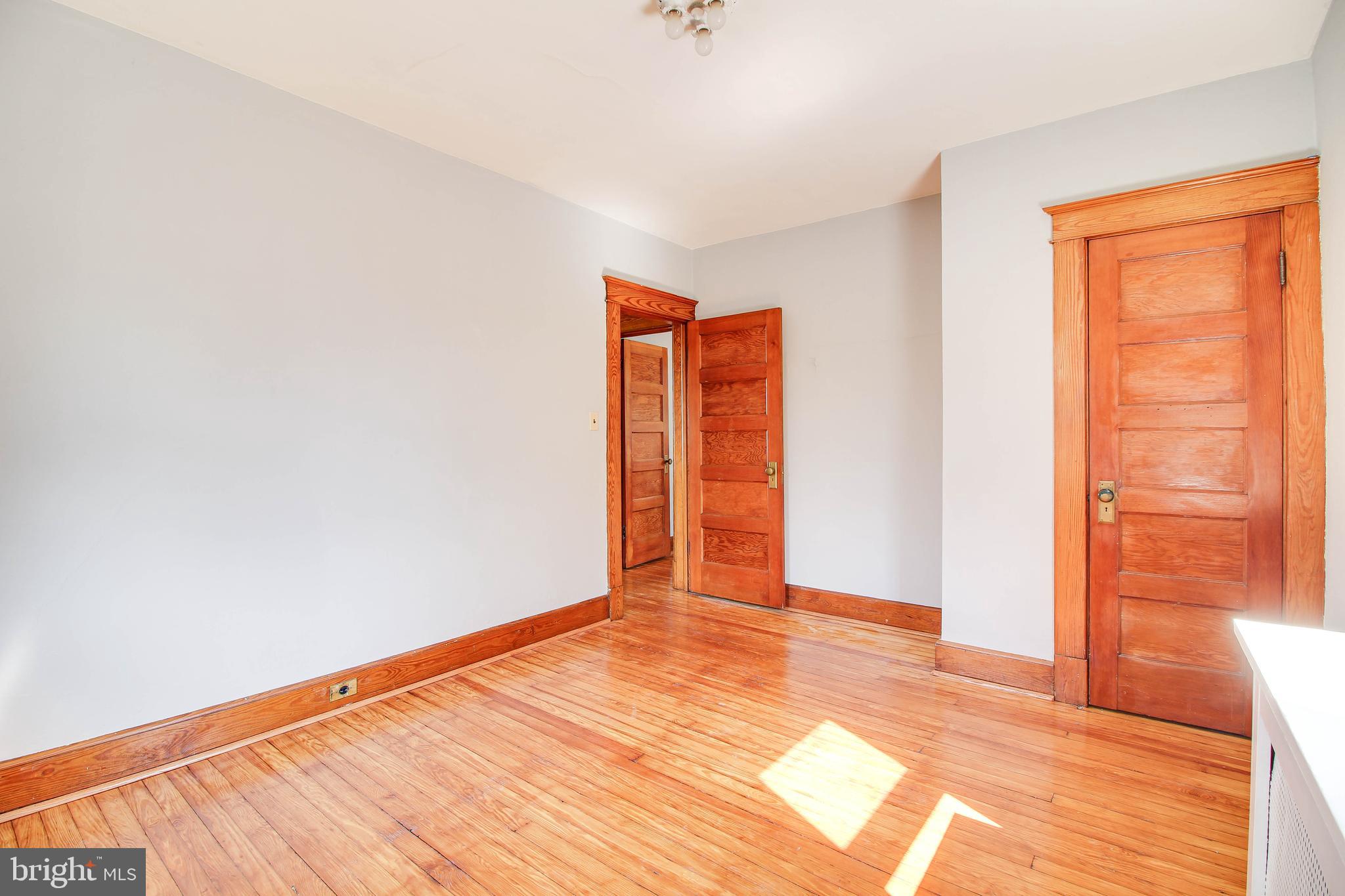 5302 Wendley Road Baltimore, MD 21229 - Photo 17 of 38 a view of an empty room with wooden floor
