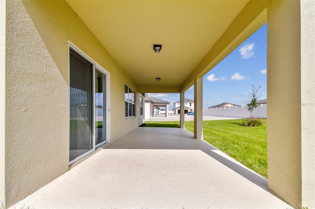 6793 Southwest 90th Loop Ocala, FL 34476 - Photo 23 of 23 a view of a big room with a balcony and yard