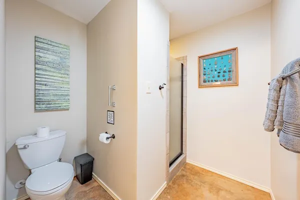 a white toilet sitting next to a bathroom sink