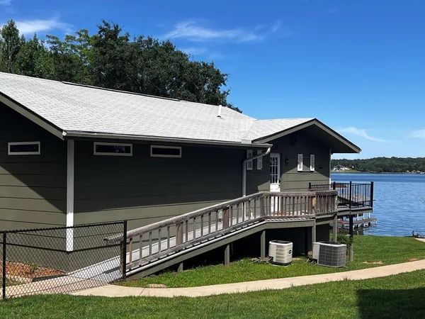 a view of house and outdoor space with swimming pool