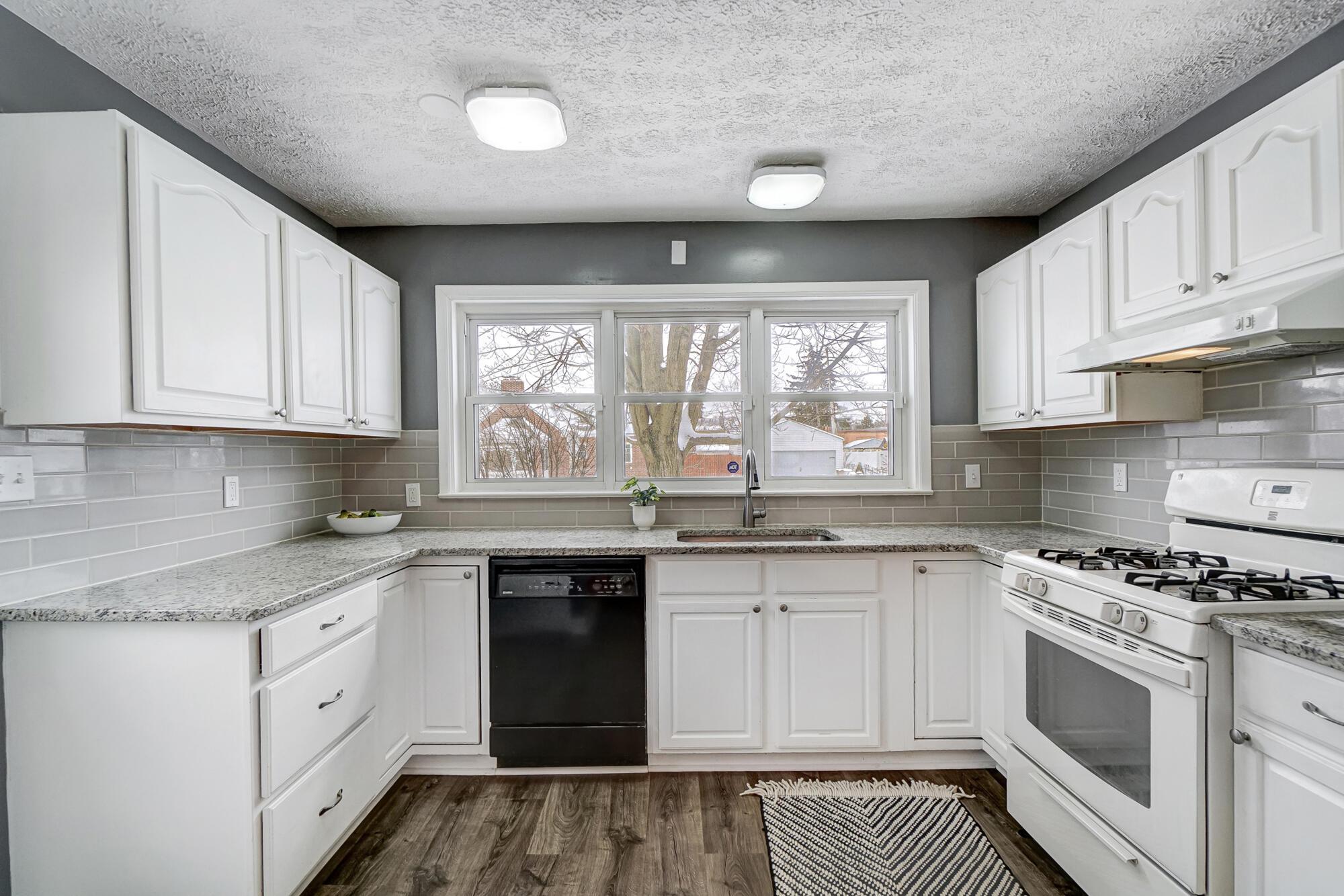 2990 Parkside Road Columbus, OH 43204 - Photo 9 of 34 Lovely large kitchen with wonderful windows above the giant sink.