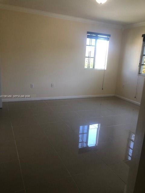 15430 Southwest 284th Street, Unit 6307 Homestead, FL 33033 - Photo 12 of 17 a view of an empty room and window